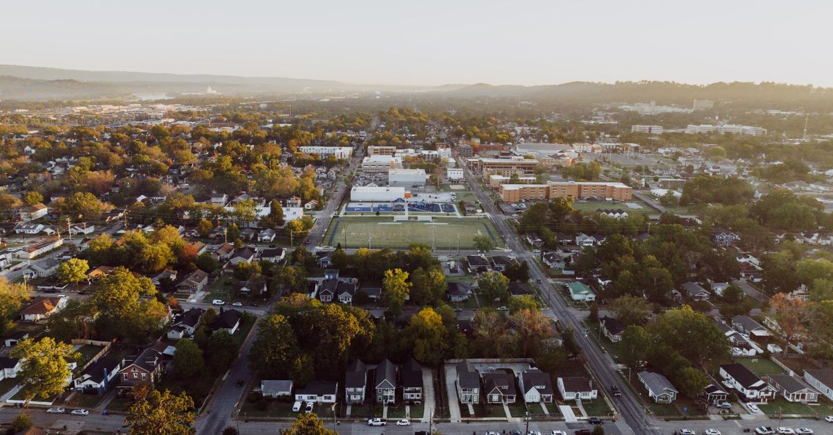 Explore the scenic aerial view of suburban Chattanooga, Tennessee, highlighting residential areas and greenery.
