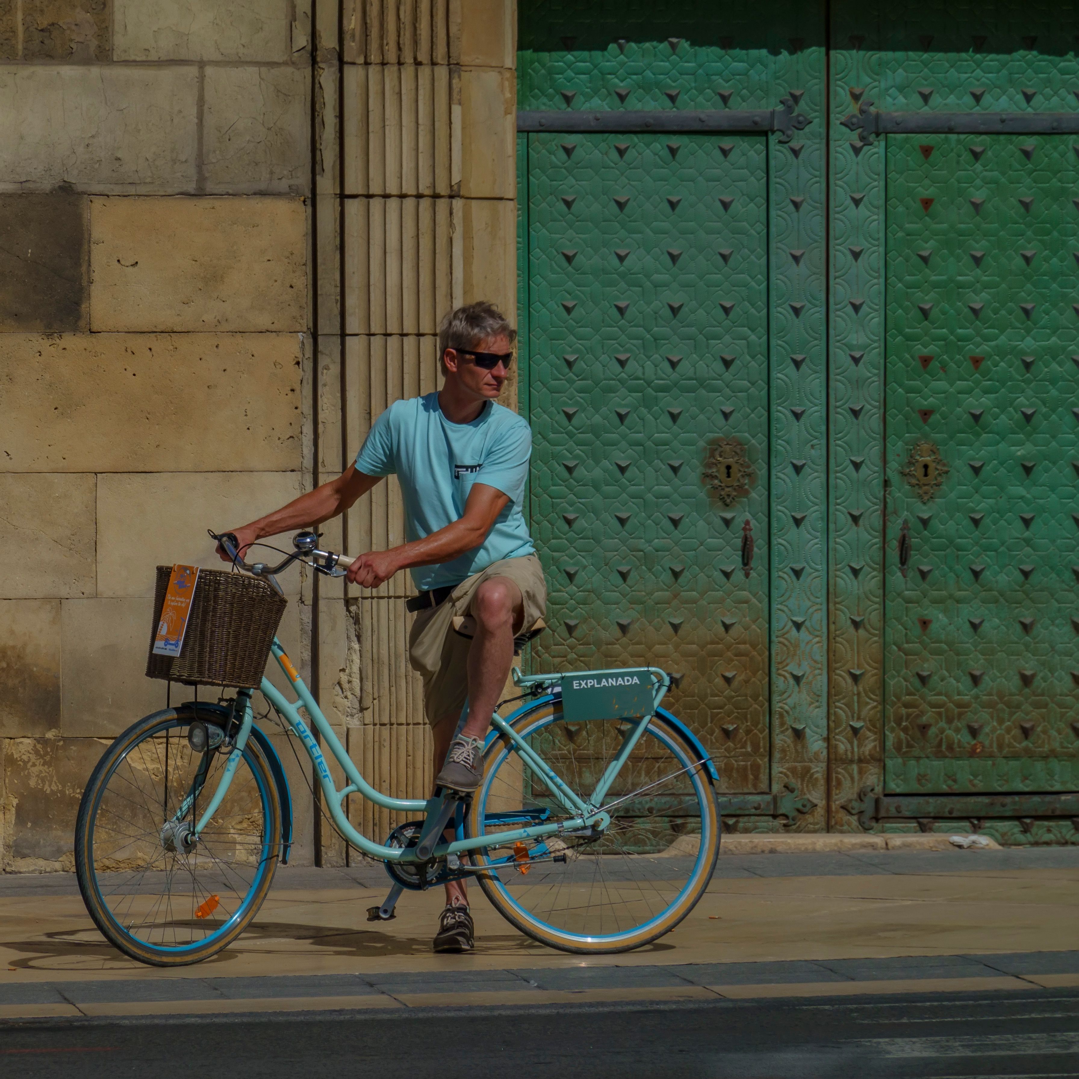 Cyclist Relaxing by Rustic Alicante Doorway