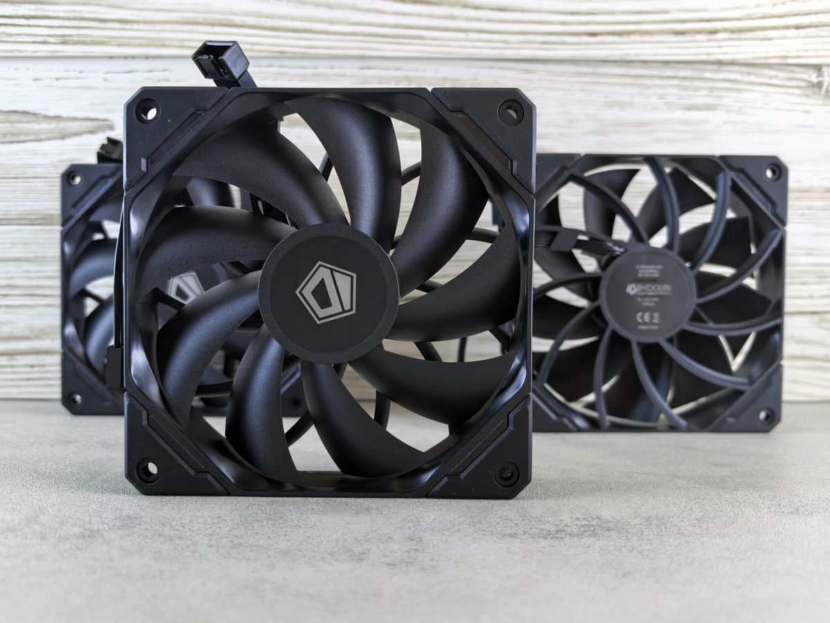 Close-up of three high-performance computer cooling fans arranged in a stack