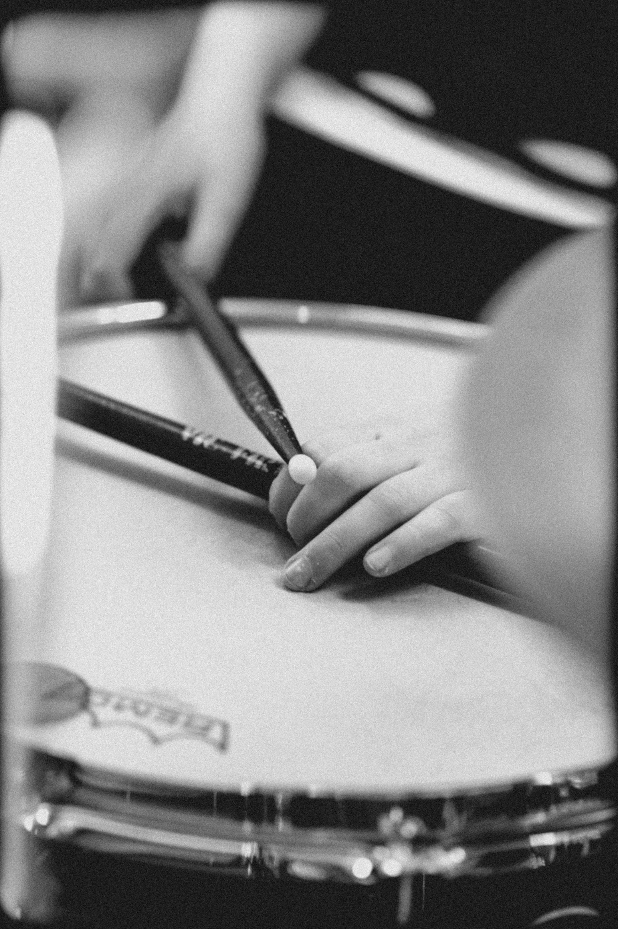 Closeup of Drumsticks on Snare Drum in Black and White · Free Stock Photo