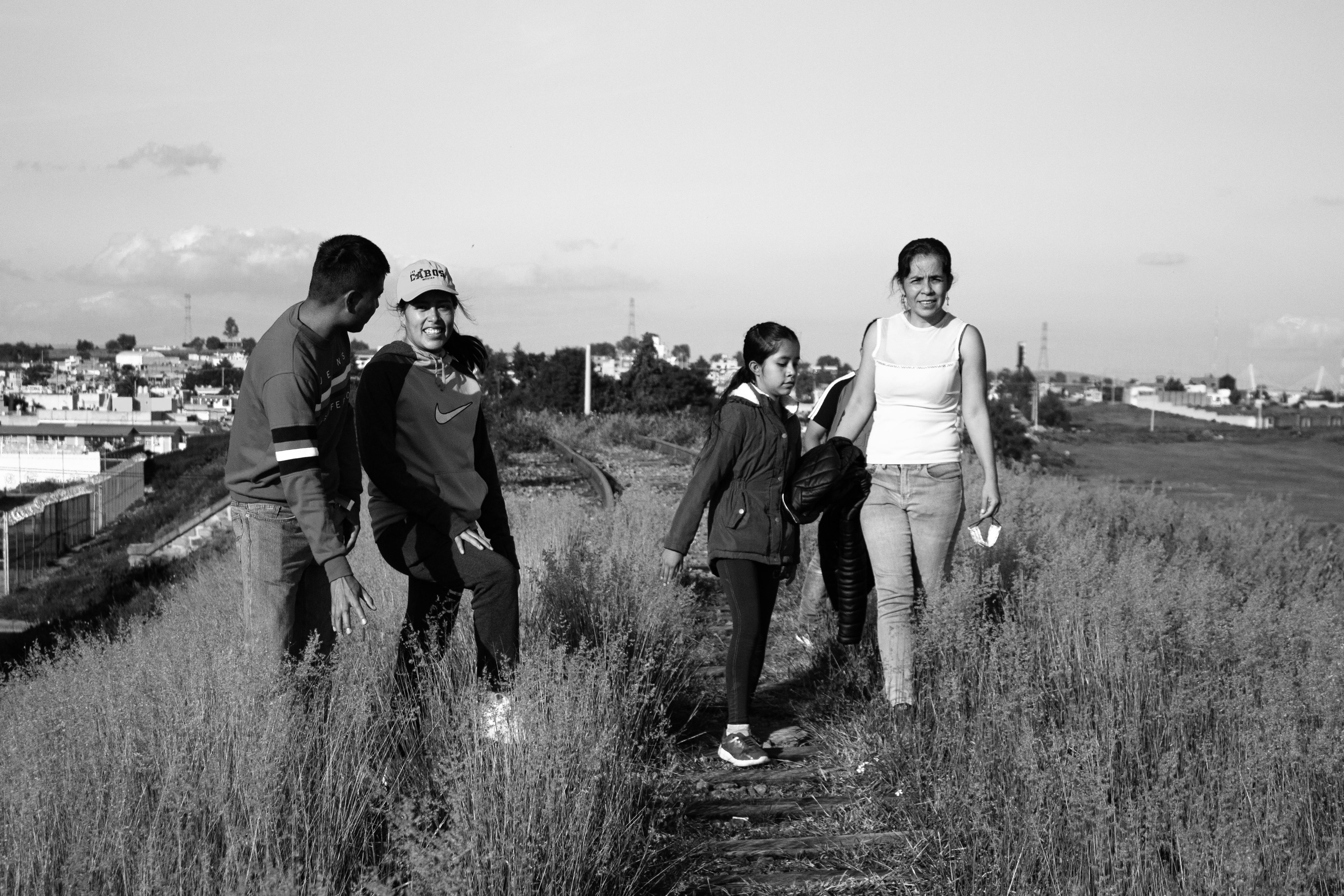 Family Walk on Train Tracks in Mexico · Free Stock Photo