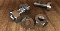 Two Gray Bolts and Nuts on Wooden Surface
