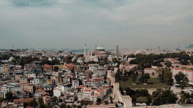 A stunning aerial shot of Istanbul's skyline highlighting the historic Hagia Sophia against a backdrop of the cityscape.