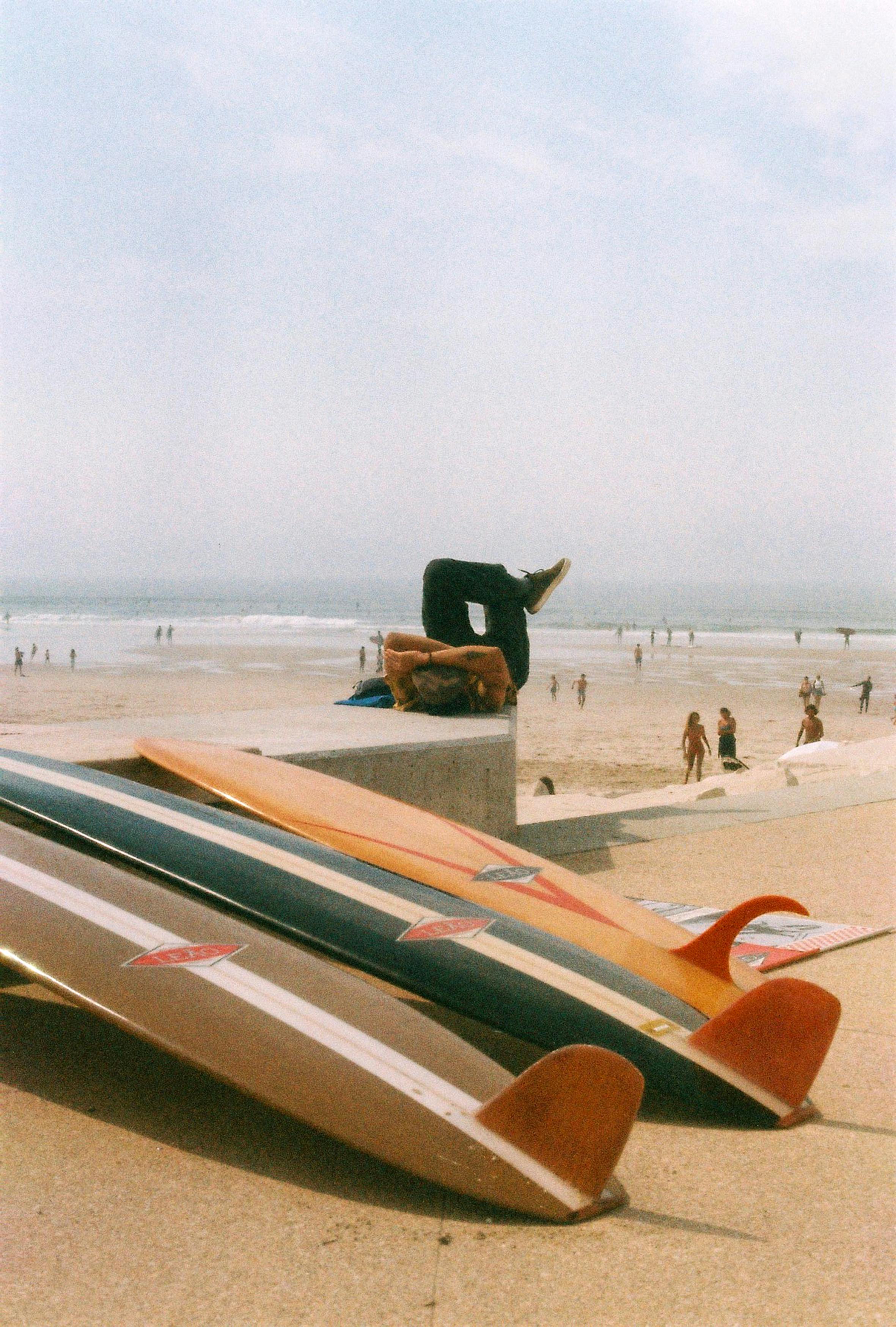 beach surfboards and sunbather at figueira da foz