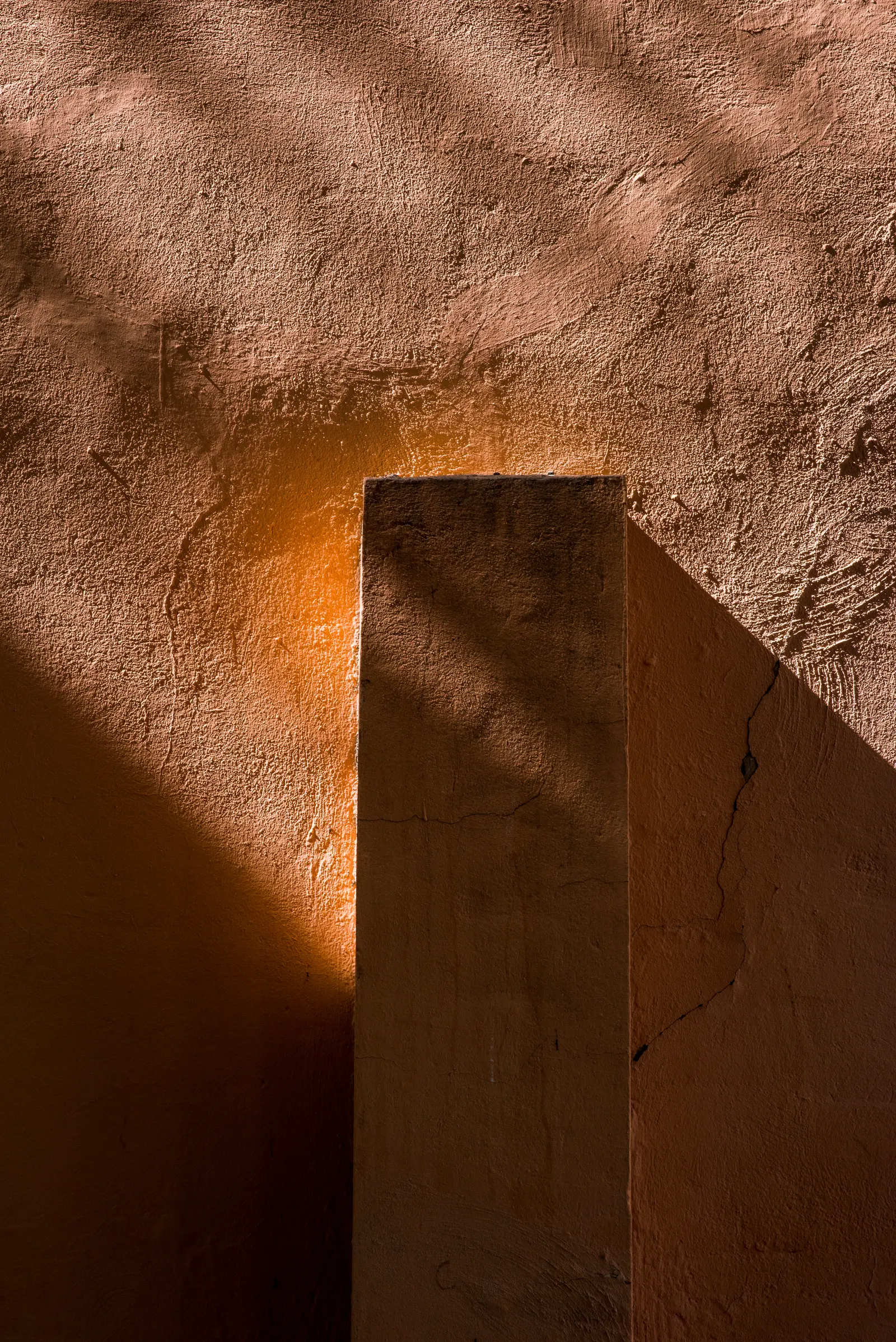 Sunlit wall with dramatic shadows