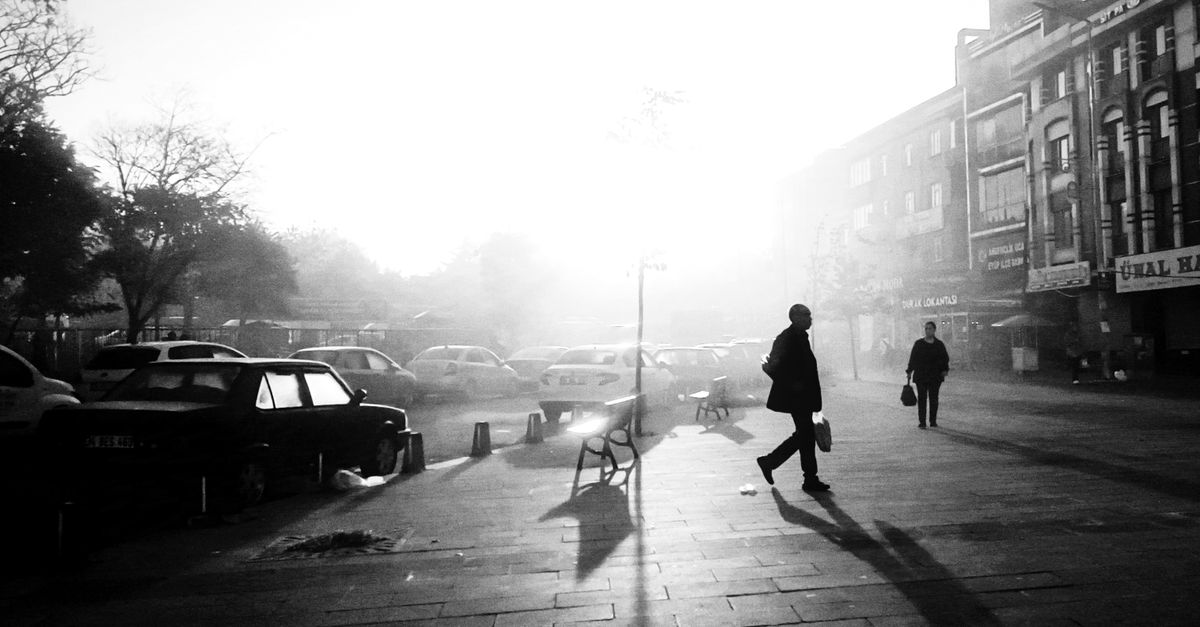 person walking outdoors morning light peaceful street