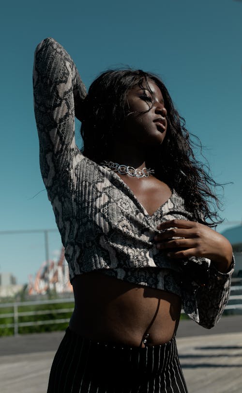 Free Photo of Woman in Snakeskin Long-sleeved Crop-top Posing Stock Photo