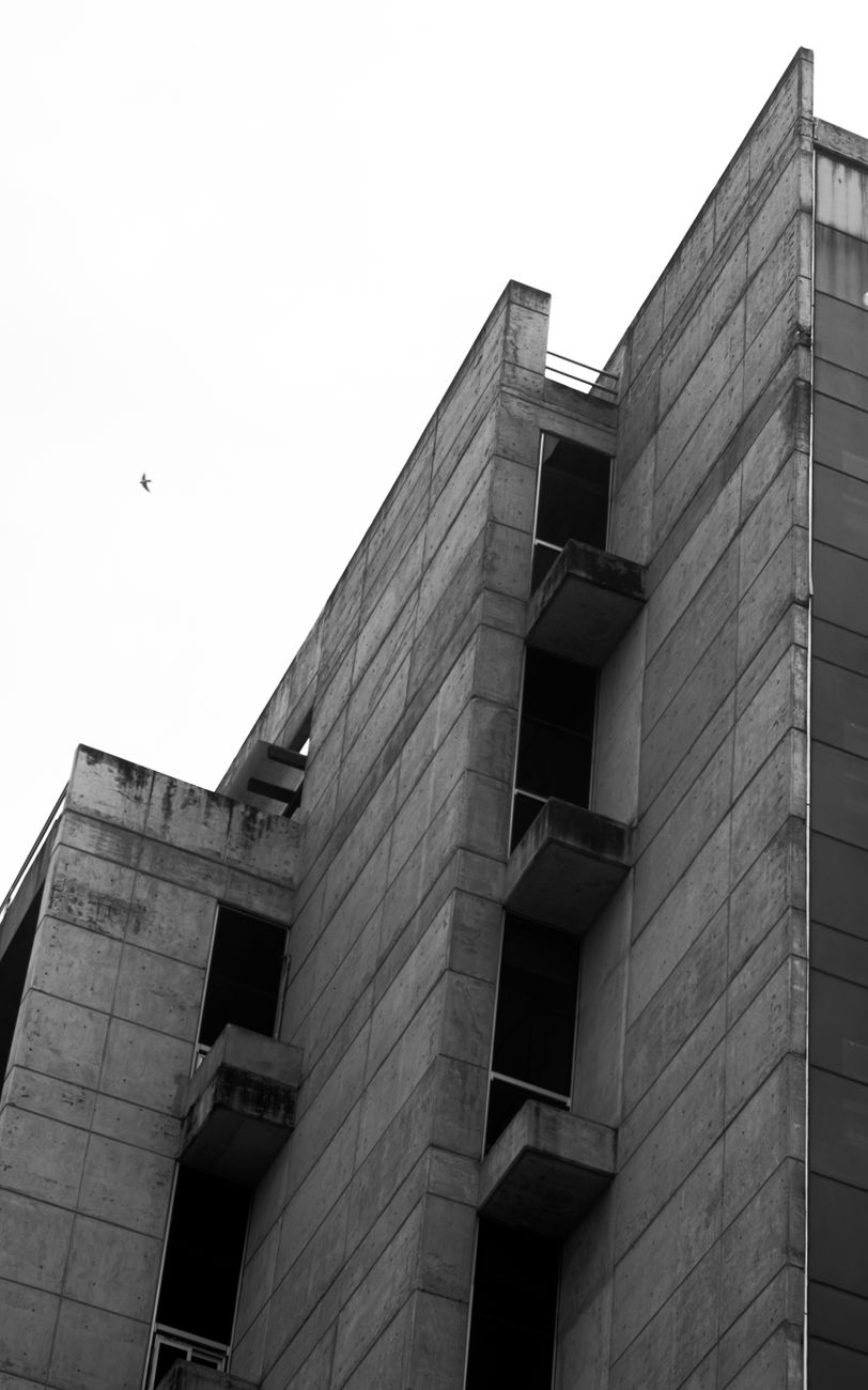 Black and white photo of brutalist architecture in Xalapa, Mexico, showcasing concrete geometric forms.. pexels, black, white