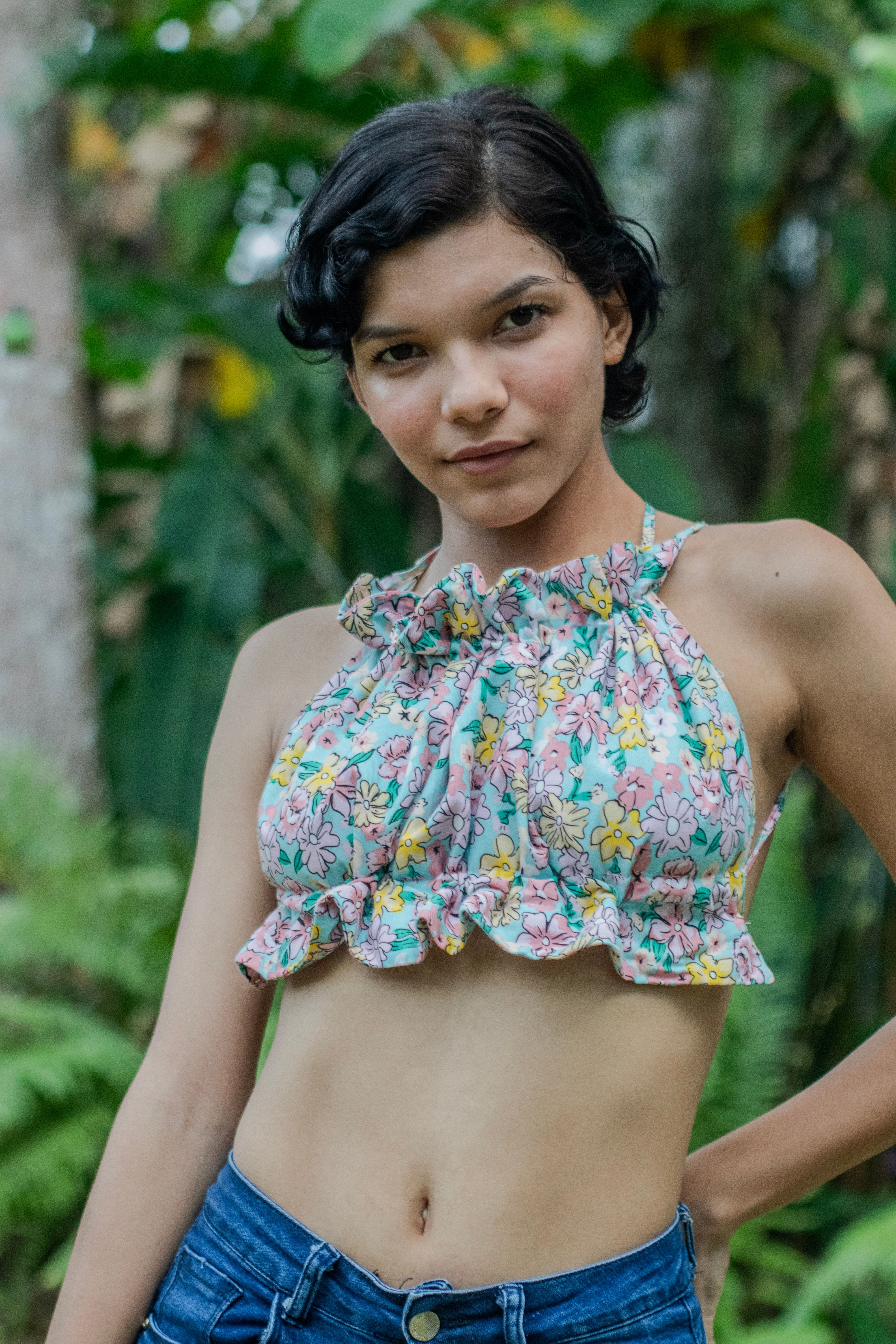 Young Woman Posing in Floral Top Outdoors · Free Stock Photo