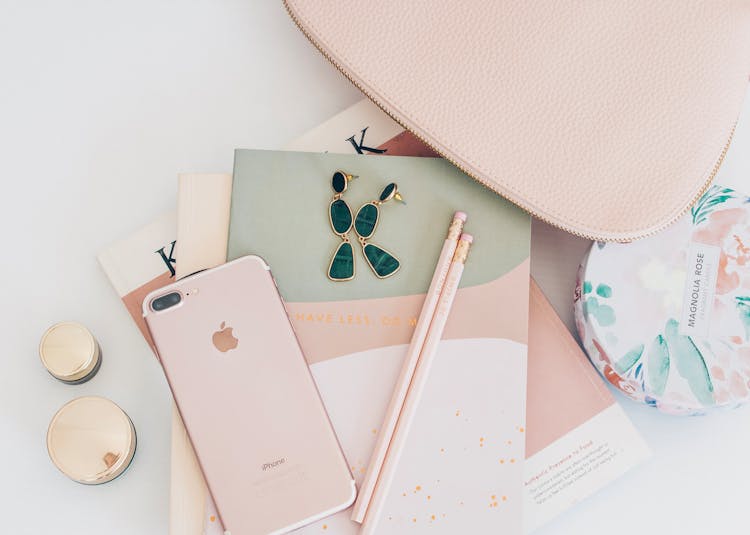 Rose Gold Iphone 7 Plus Beside Pencils On Book