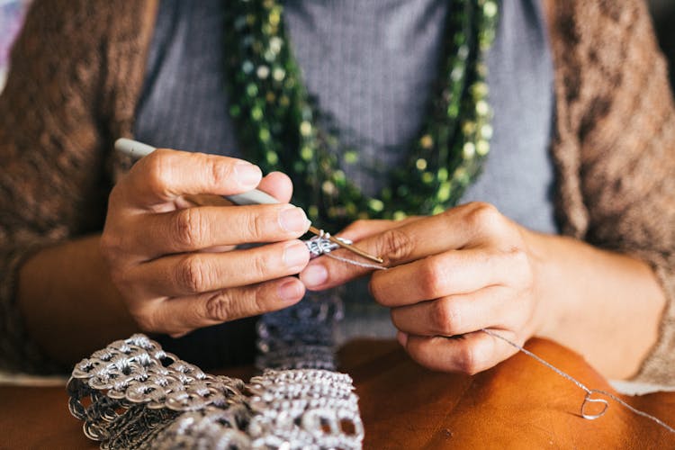 Person Holding Crochet Hook