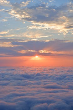 A breathtaking sunrise over a sea of clouds, capturing nature's beauty.