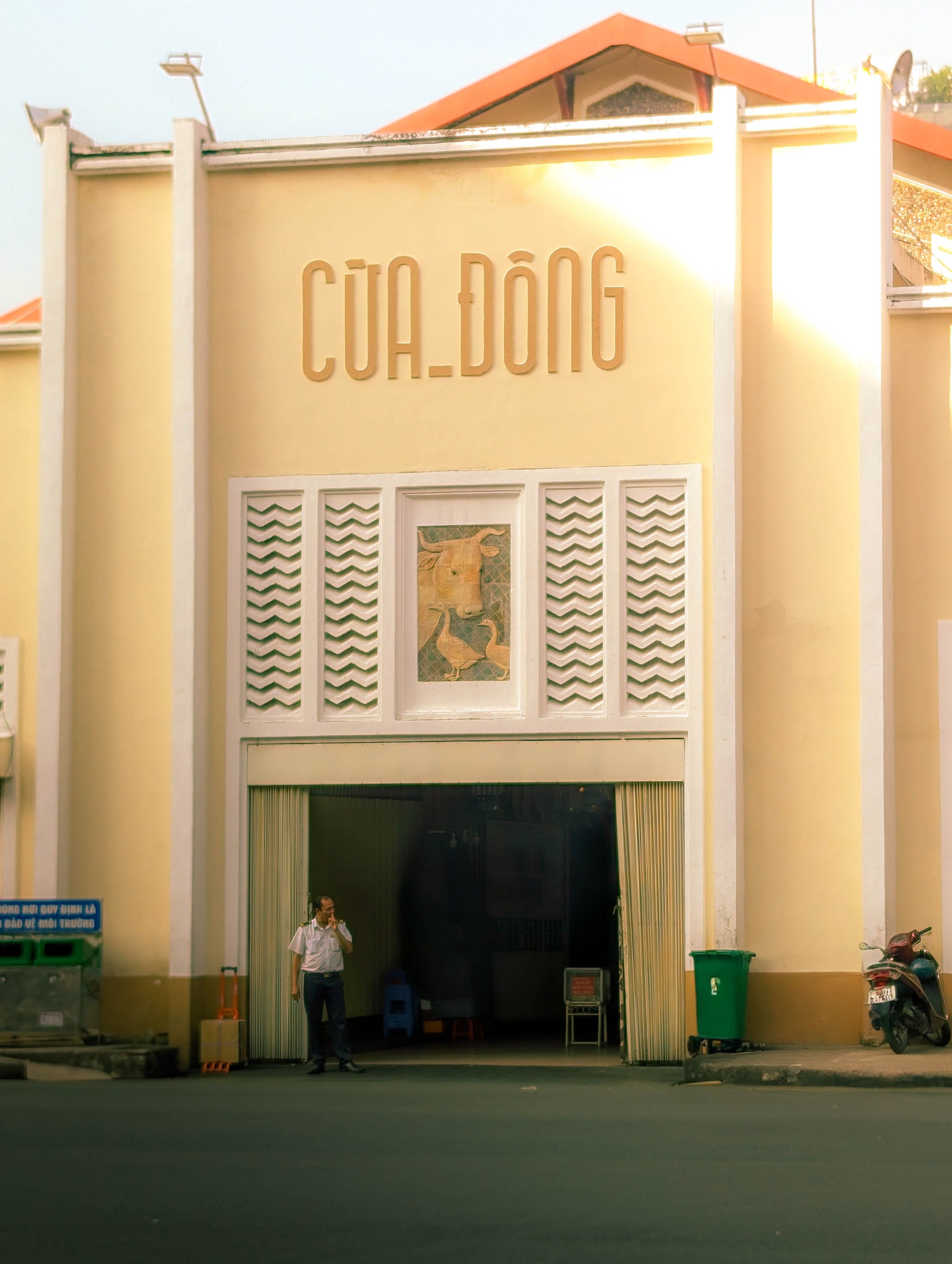 View of the Cua Dong entrance of a historic Vietnamese market building with unique architectural features.