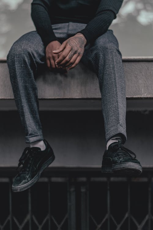 Person Wearing Black Low-top Sneakers