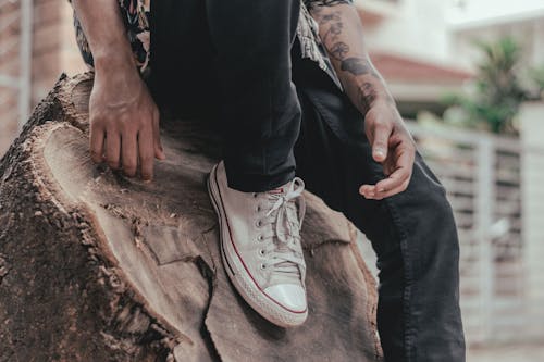 Free Photo of Person's Foot on Tree Stump Stock Photo