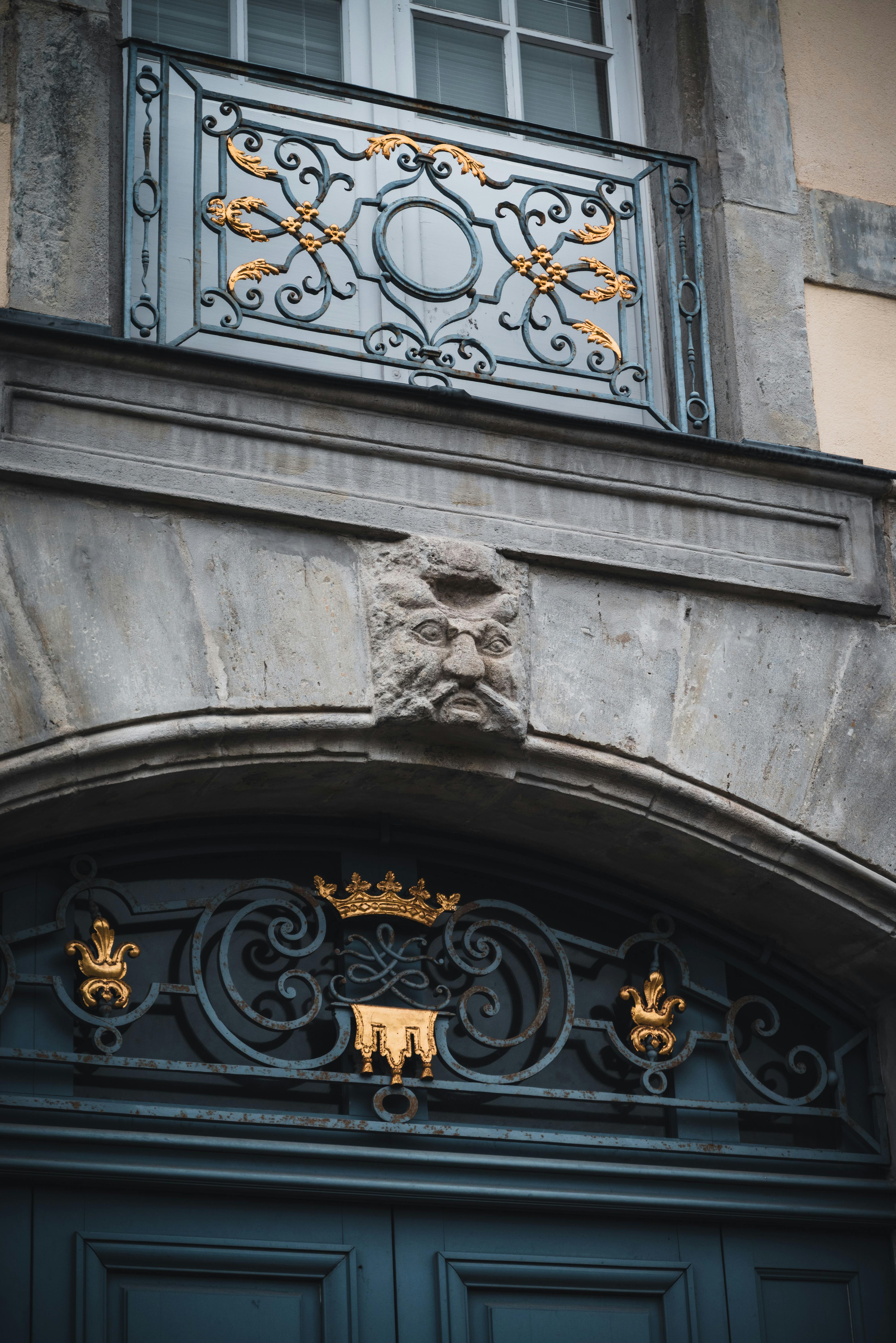 Intricate architectural elements with gold accents in Carcassonne, France.