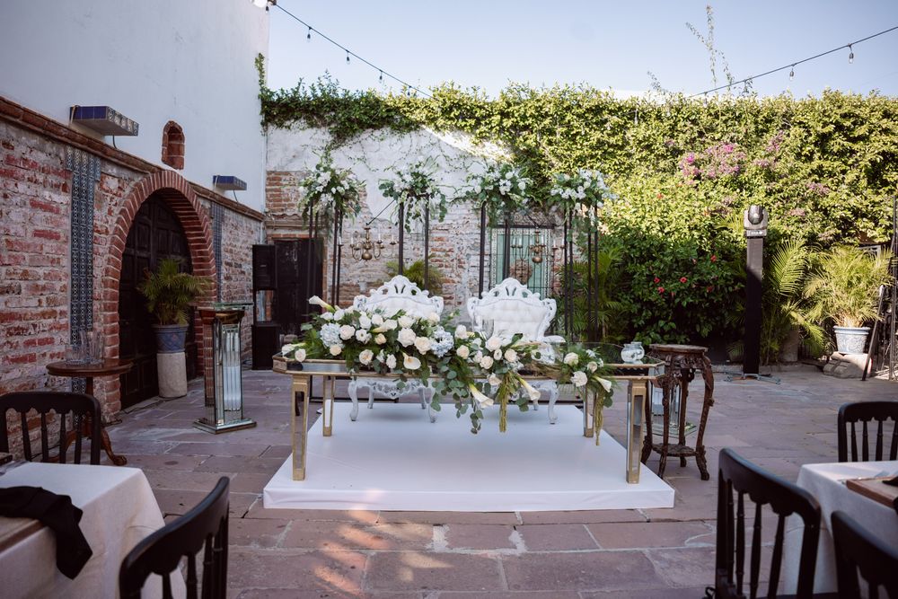 An elegant outdoor wedding venue with floral decor