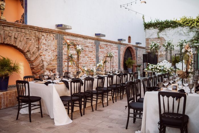 Chic outdoor venue with decorated tables and chairs