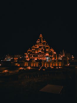 Beautiful illuminated architecture at night in India, showcasing intricate design and grandeur.