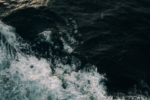 Free Aerial view of powerful ocean waves crashing in Dumaguete, Central Visayas, Philippines. Stock Photo