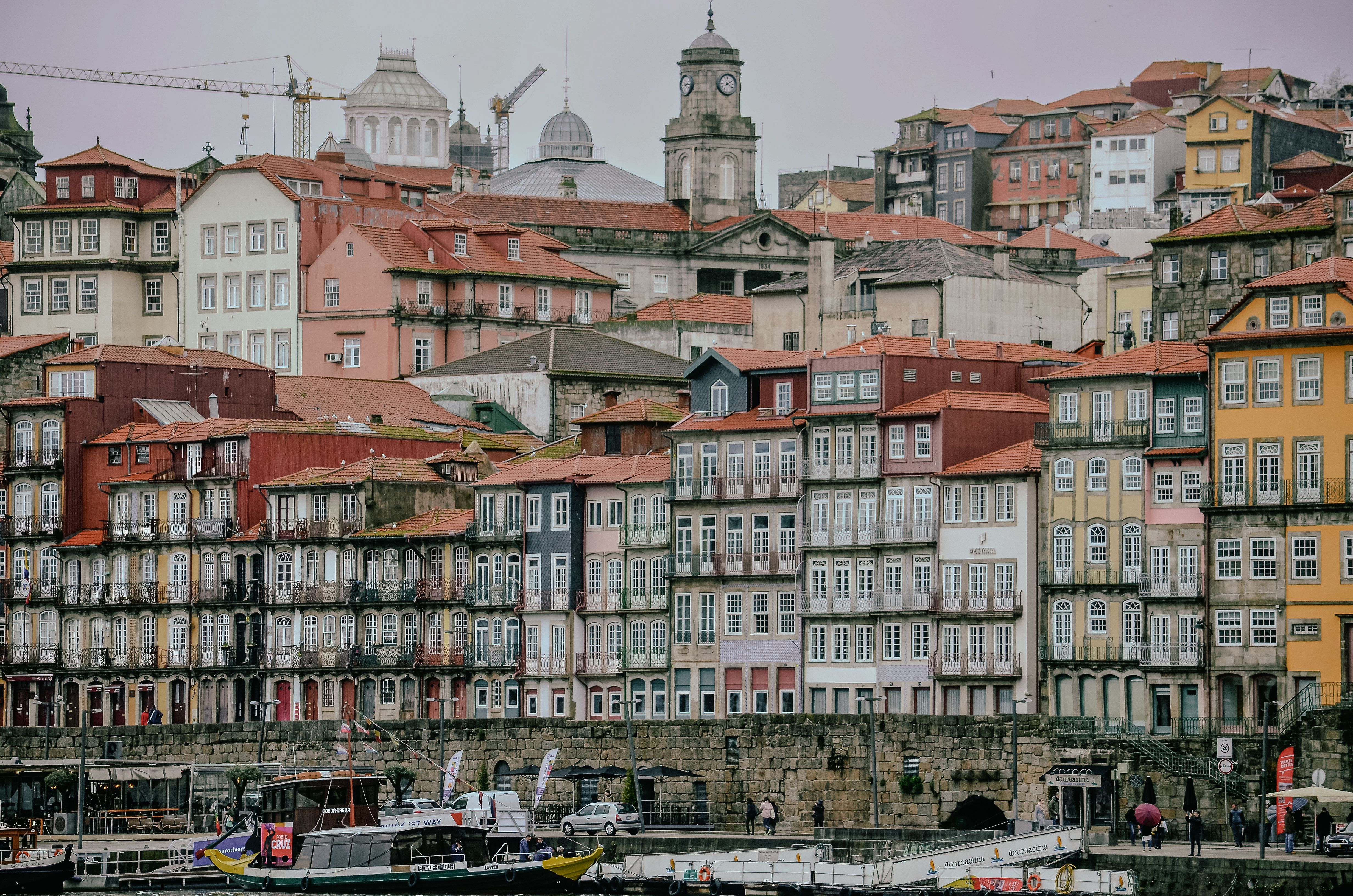 Colorful pastel facades of Ribeira district buildings along the Porto waterfront