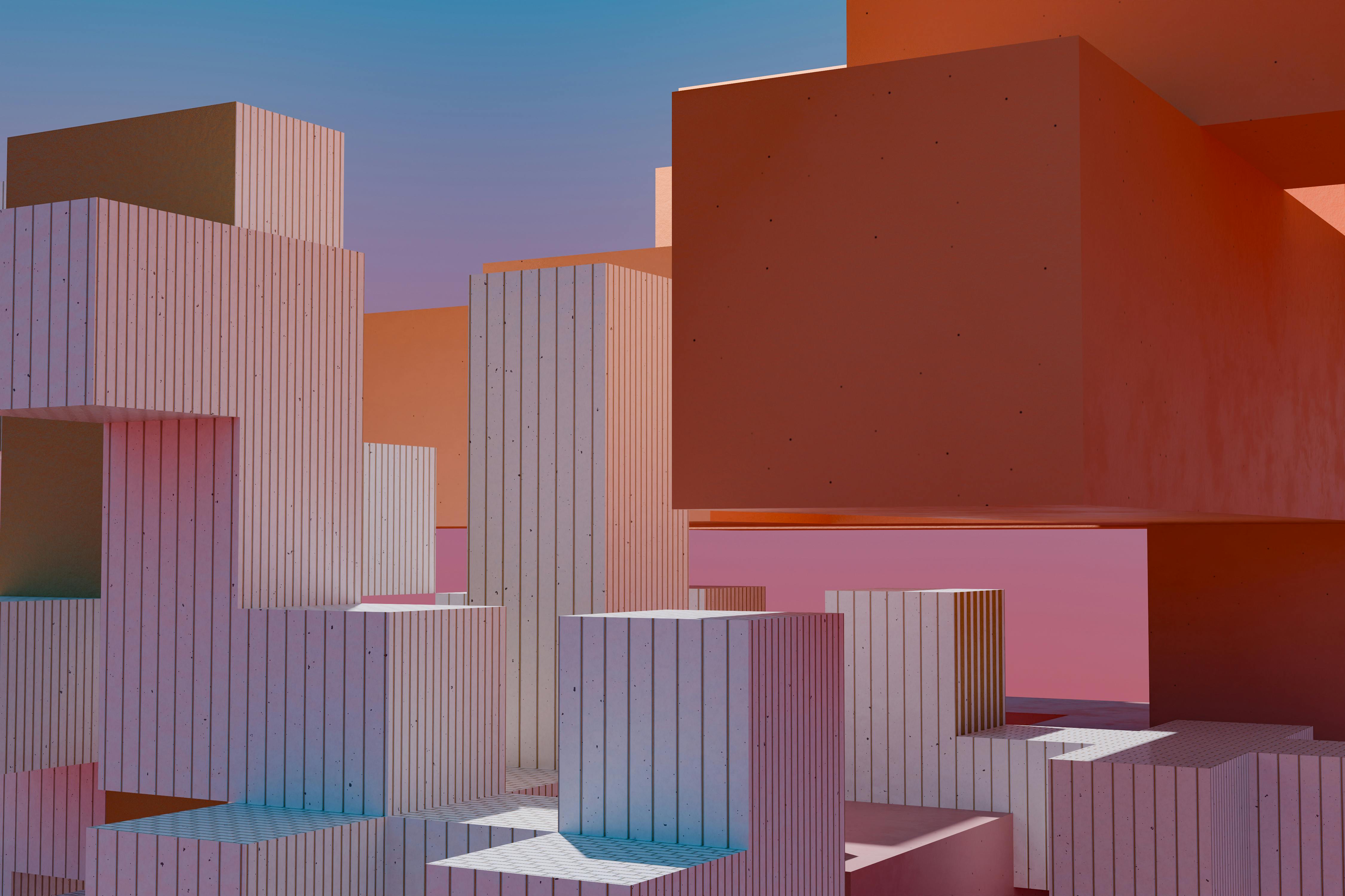 Modern abstract architecture with geometric block shapes and vibrant sunset hues.