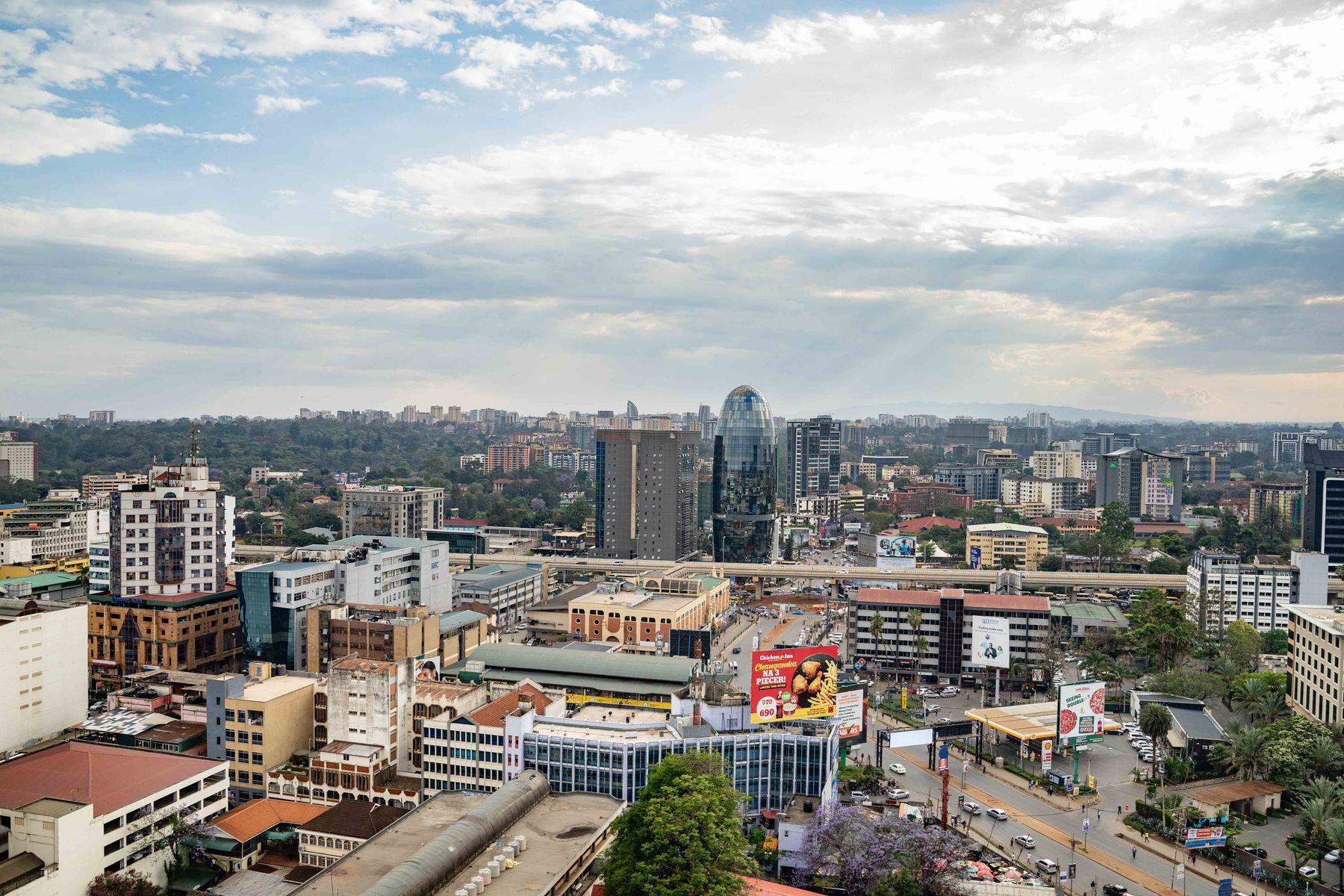 Aerial view of Nairobi's leafy suburbs and skyline showing the residential neighbourhoods that ring the city centre
