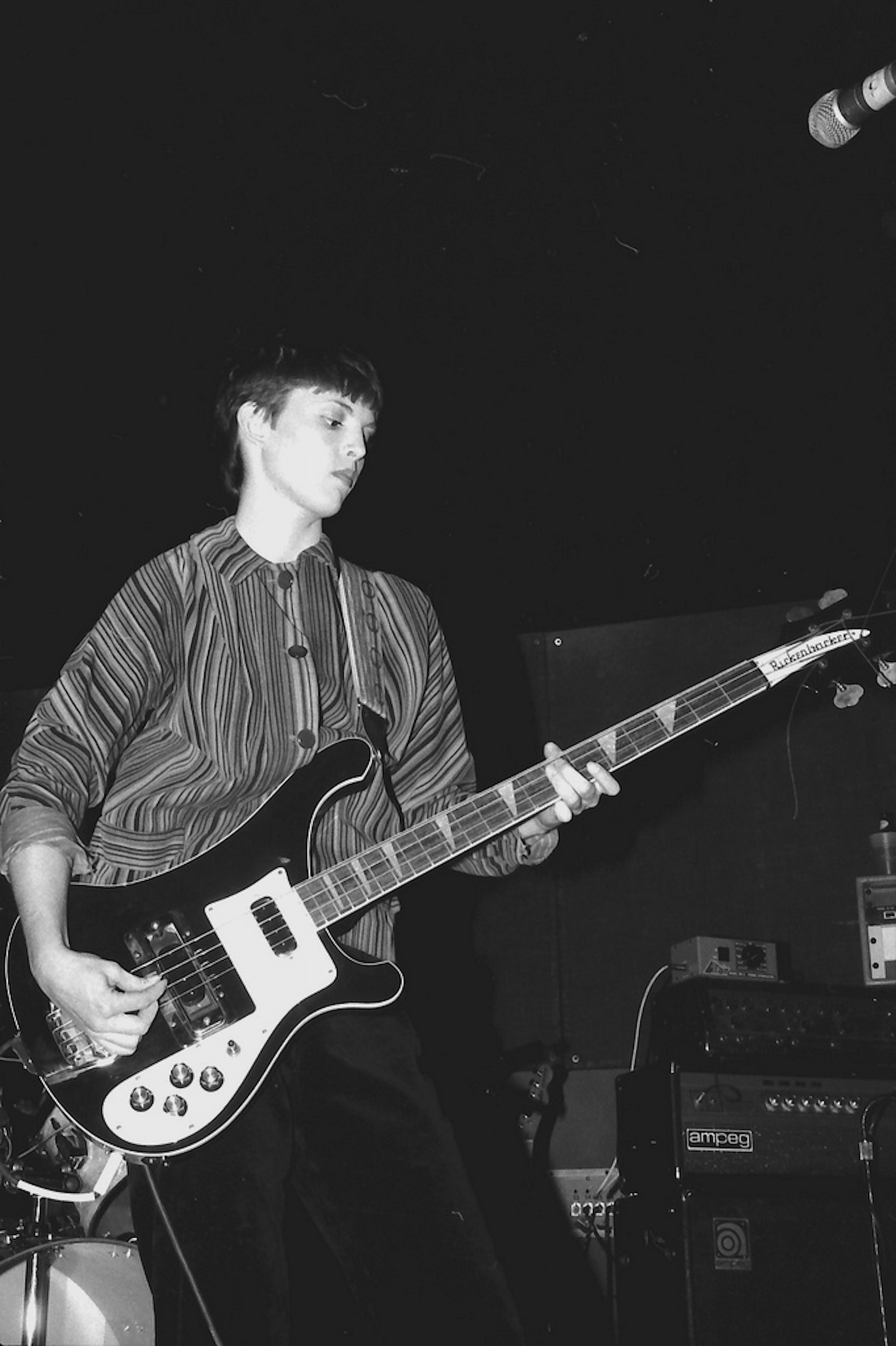 female bass guitarist performing on stage