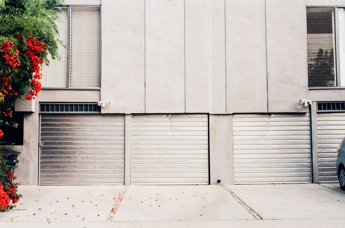 Minimalist gray garage door on a modern home facade