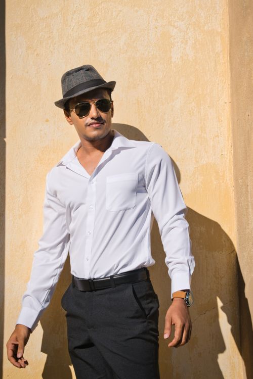 Free A confident male model poses outdoors in Sanssouci Park, Potsdam, wearing formal attire. Stock Photo