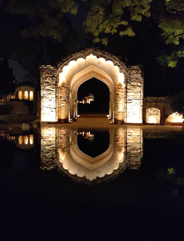 Lighted Concrete Arch At Night