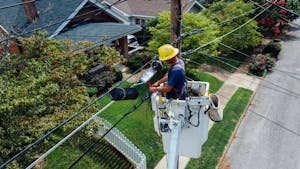 Photography of Man Repairing Electrical Wires