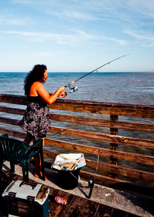 Photo of Woman Using Fishing Rod · Free Stock Photo
