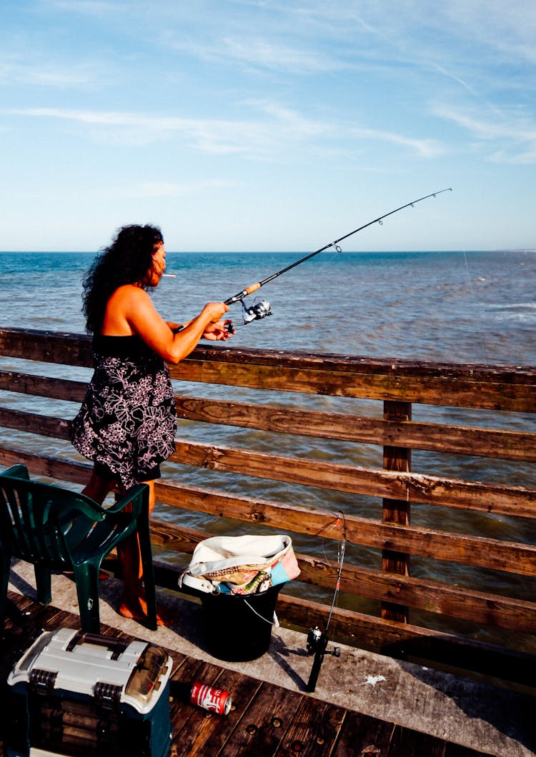 Photo Of Woman Using Fishing Rod