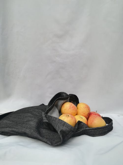 Yellow and Red Apple Fruits in bag