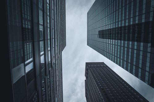 Free Upward view of New York City's skyscrapers against a cloudy sky, showcasing modern architecture. Stock Photo