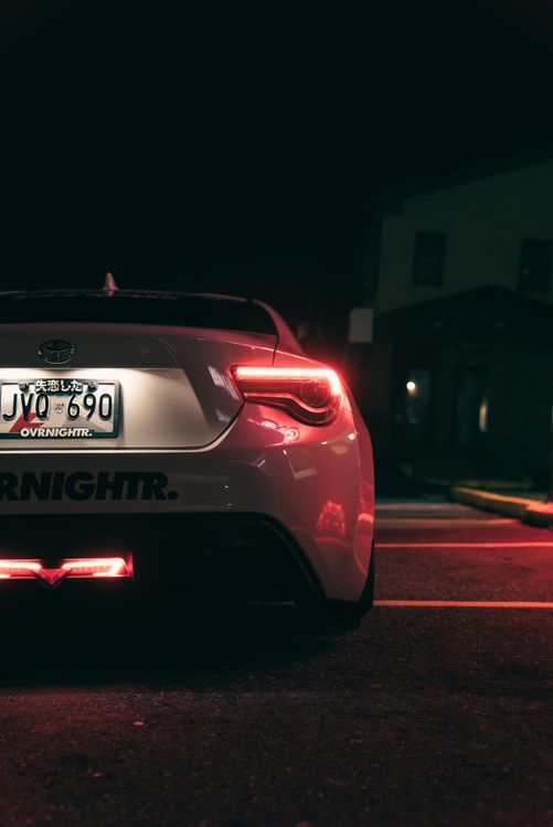 Car Rear At Night Rear View of a Stylish Car at Night · Free Stock Photo