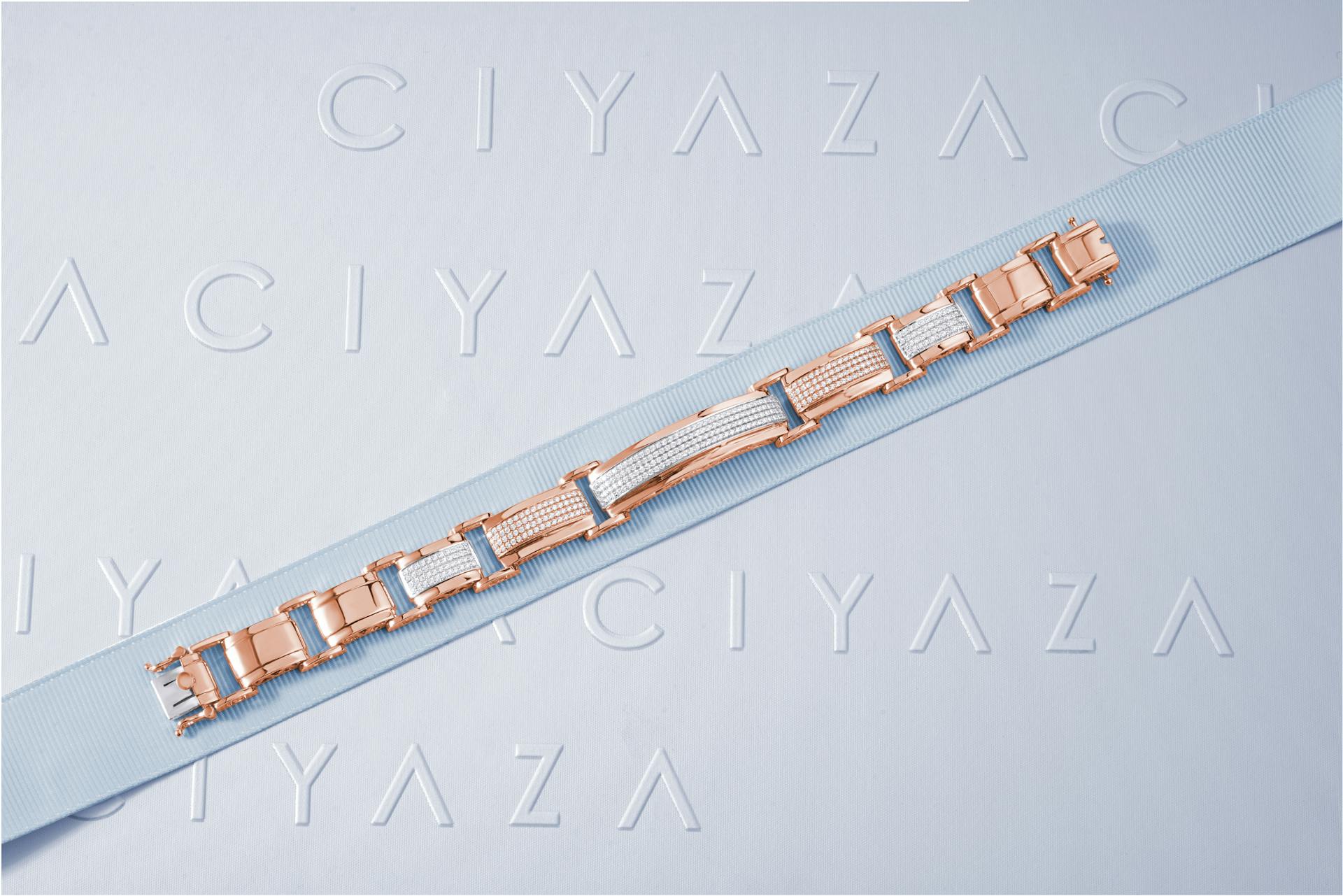 Sleek rose gold jewelry elegantly displayed on a Ciyaza embossed surface, perfect for fine jewelry enthusiasts.