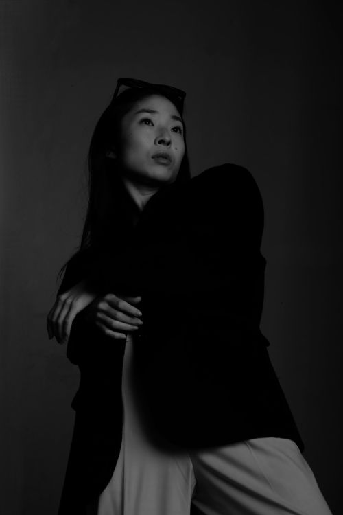 Free Stylish black and white portrait of a model in a contemplative pose. Stock Photo