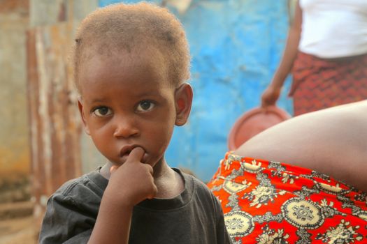 Close portrait of a child in Freetown, illustrating urban life in Sierra Leone.