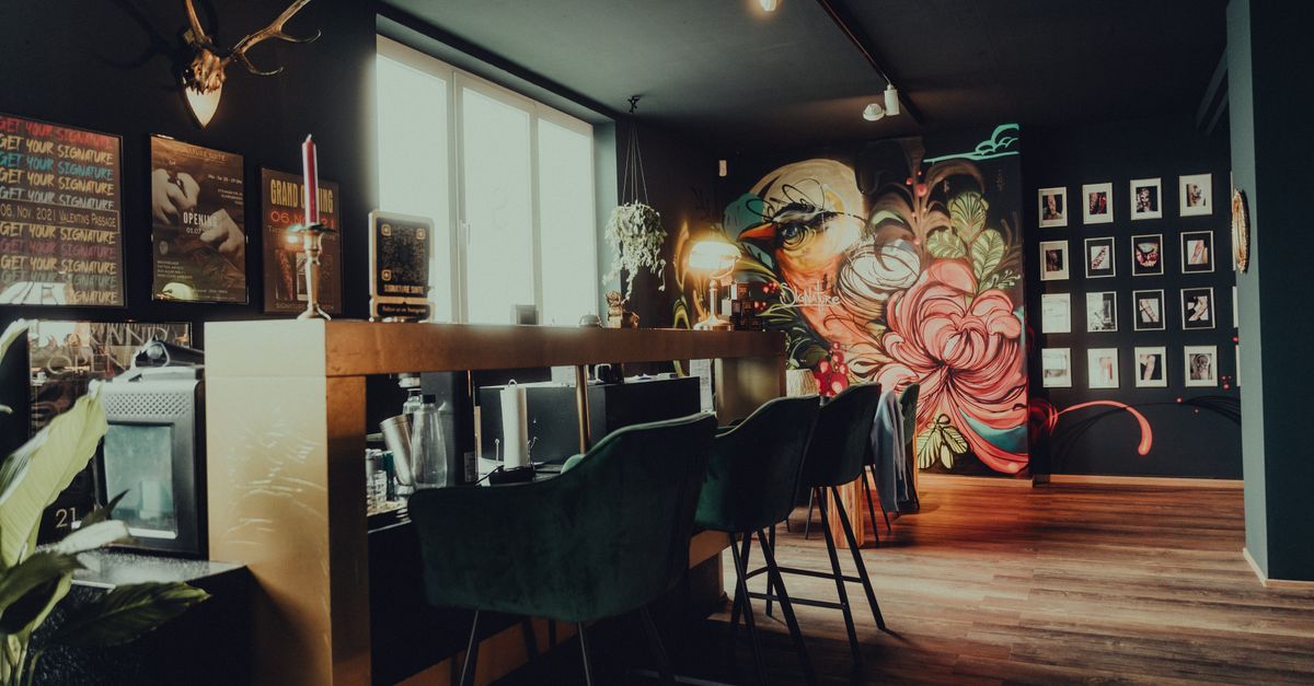 Colorful Tattoo Studio Interior with Artistic Murals · Free Stock Photo