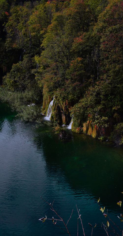 Free Scenic view of waterfalls and lush greenery at Plitvice Lakes National Park in Croatia. Stock Photo