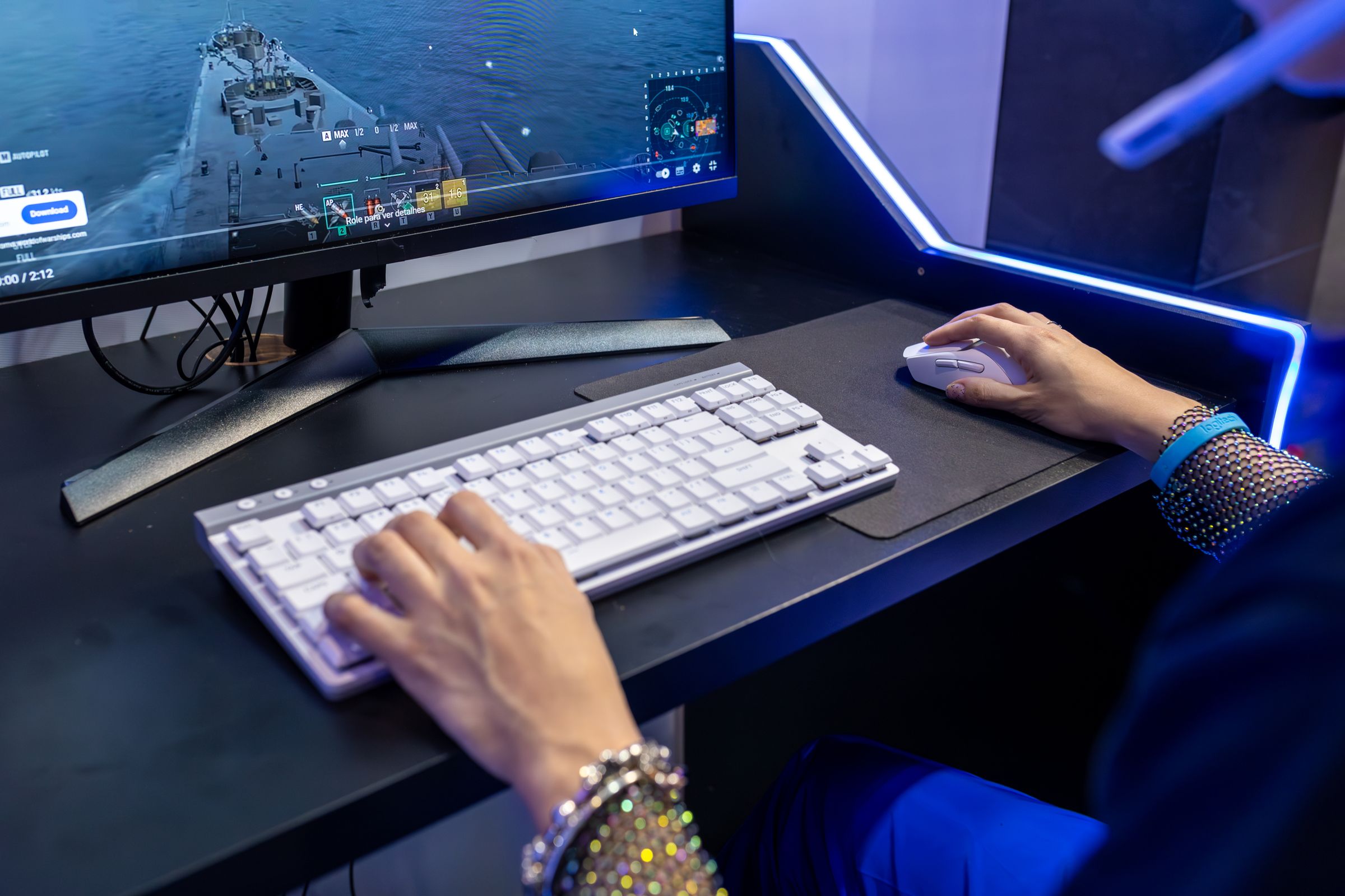 Player using a gaming keyboard and mouse during gameplay