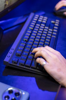 A close-up shot of a person typing on a keyboard, showcasing technology use.