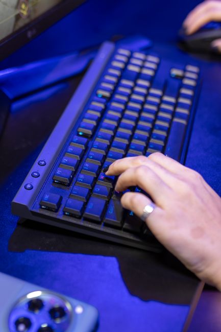 A close-up shot of a person typing on a keyboard, showcasing technology use. - Semantic Keyword Matching: How Modern ATS Filters Candidates Without Exact Word Matches