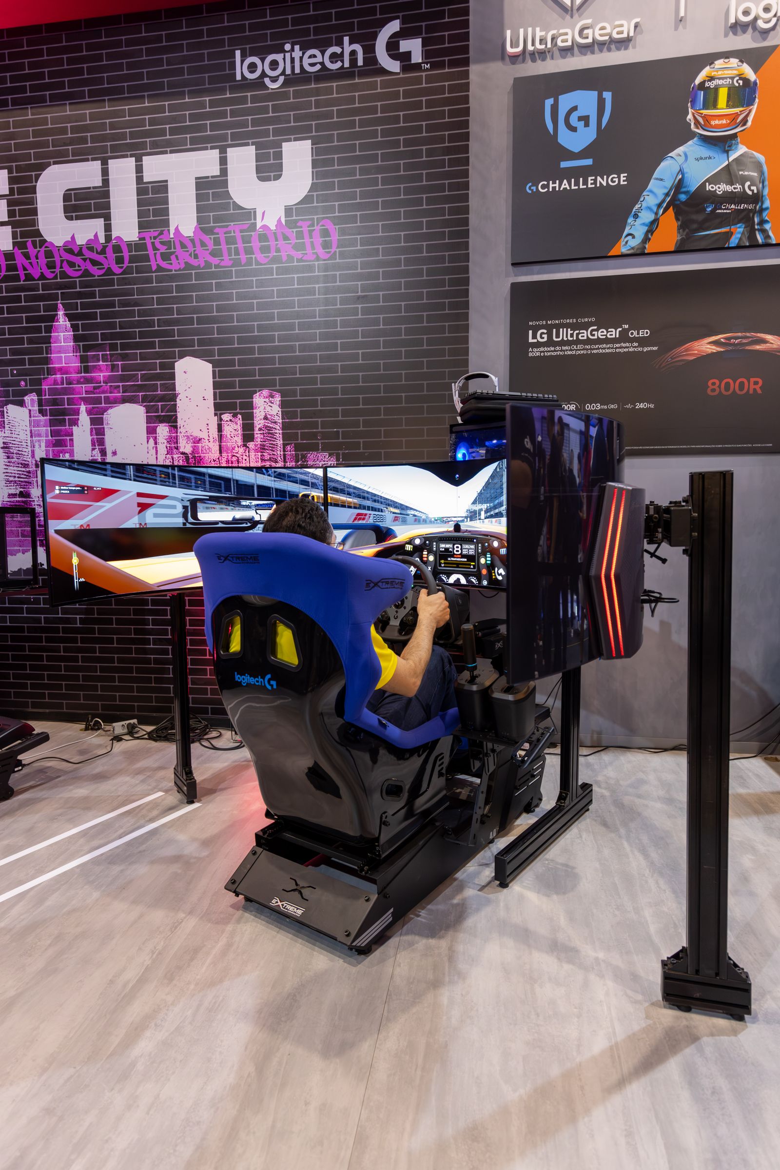 Immersive racing simulator with steering wheel, gaming seat and large display