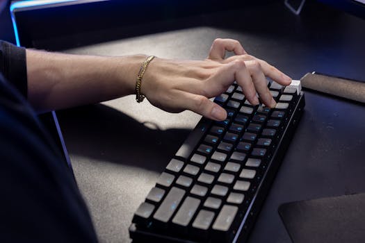 Close-up of a hand typing on a mechanical keyboard, highlighting modern technology and work.