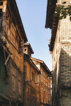 Captivating view of traditional Srinagar street with historic architecture under a clear sky.