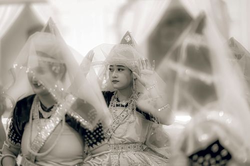 Free Captivating traditional dance scene featuring women in intricate attire during a cultural event in Imphal, Manipur. Stock Photo