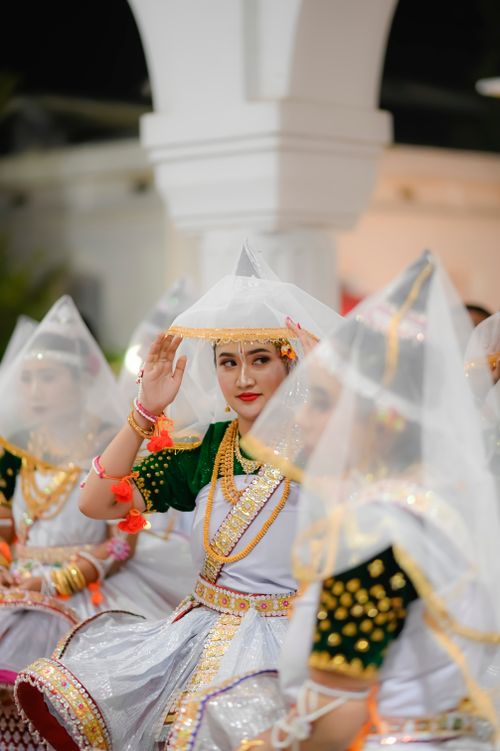 Free Women in traditional Manipuri dress performing a graceful cultural dance in Imphal, Manipur. Stock Photo